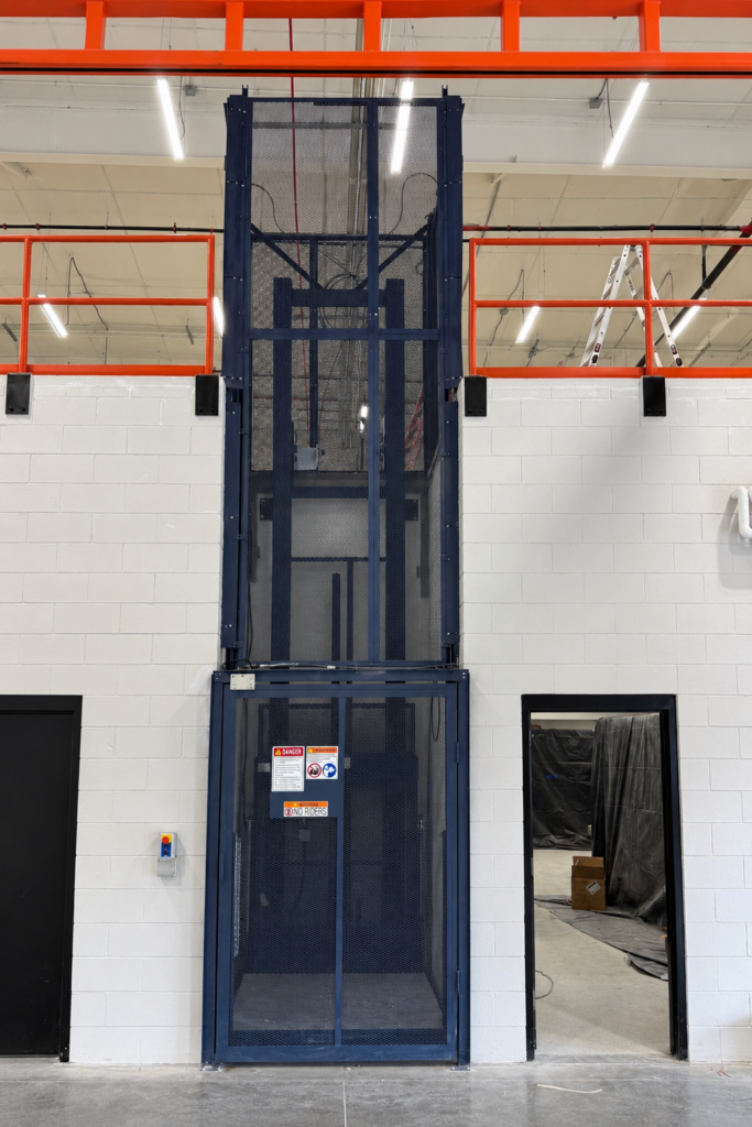 Vertical Reciprocating Conveyor - Warehouse Optimizers Inc
